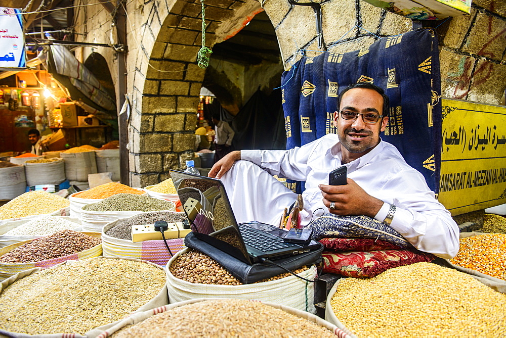 Shopkeeper at the spice market in the Old Town, UNESCO World Heritage Site, Sanaa, Yemen, Middle East