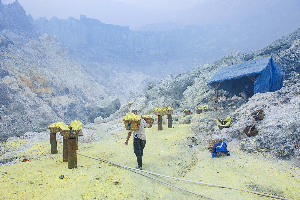 Fully loaded baskets of sulphur ready to be carried  out of the Ijen Volcano, Java, Indonesia, Southeast Asia, Asia