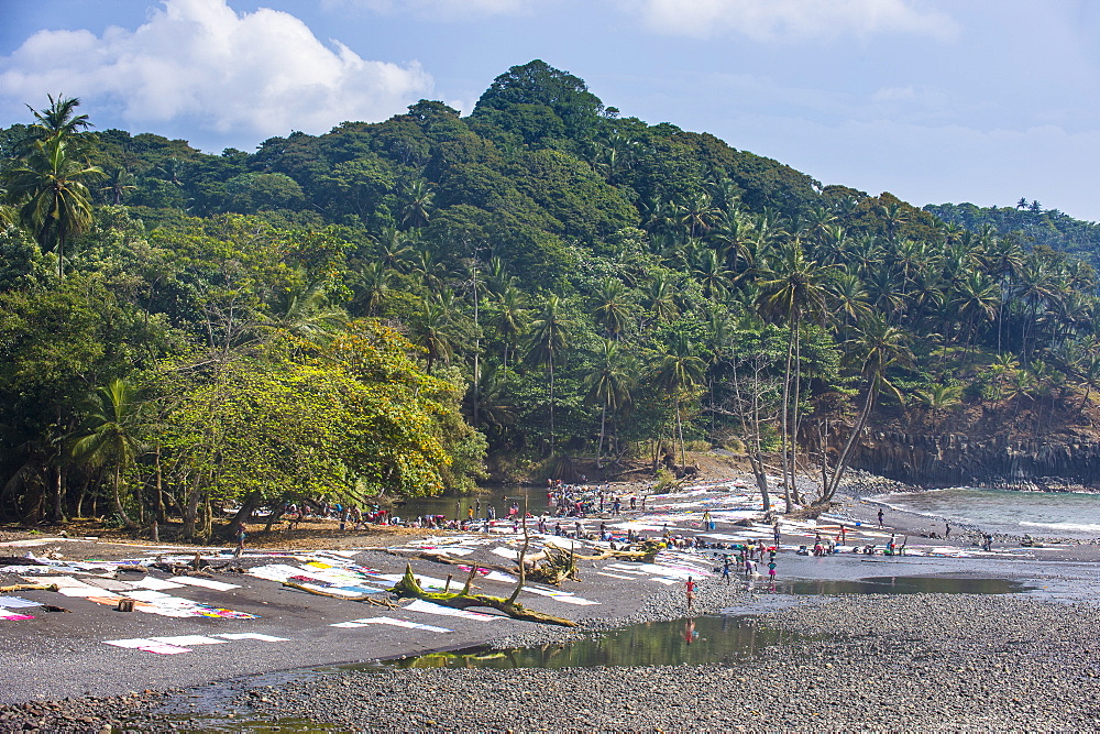 Wet clothes drying on a rocky beach, east coast of Sao Tome, Sao Tome and Principe, Atlantic Ocean, Africa