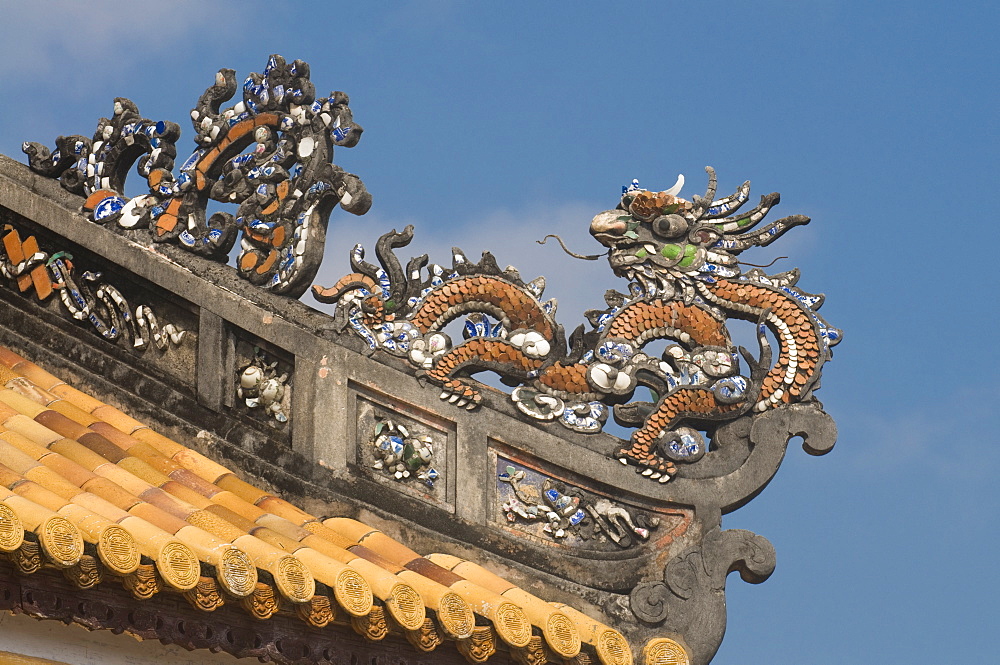 Dragons on top of the roof of the Halls of the Mandarins, Hue, Vietnam, Indochina, Southeast Asia, Asia