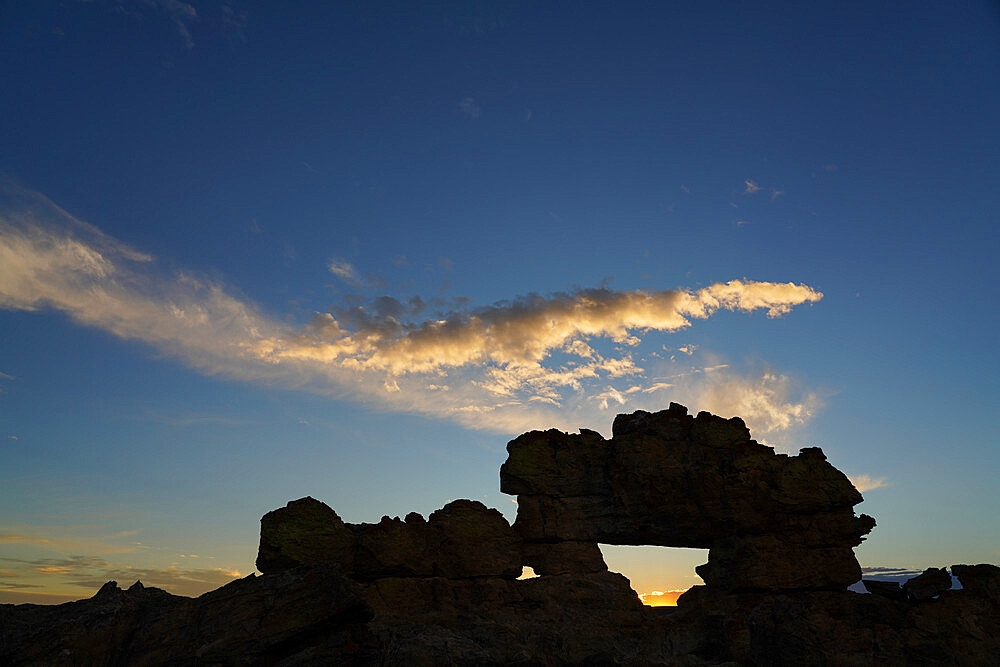 Sunset at the famous rock formation La Fenetre, Isalo National Park, Fianarantsoa province, Ihorombe Region, Southern Madagascar, Africa