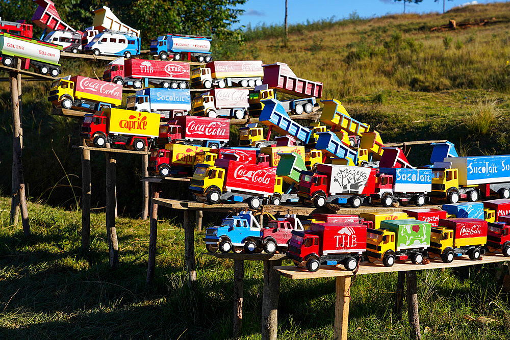 Replica trucks and lorries for sale at a roadside stall on the RN7 near Antsirabe, Central Madagascar, Africa