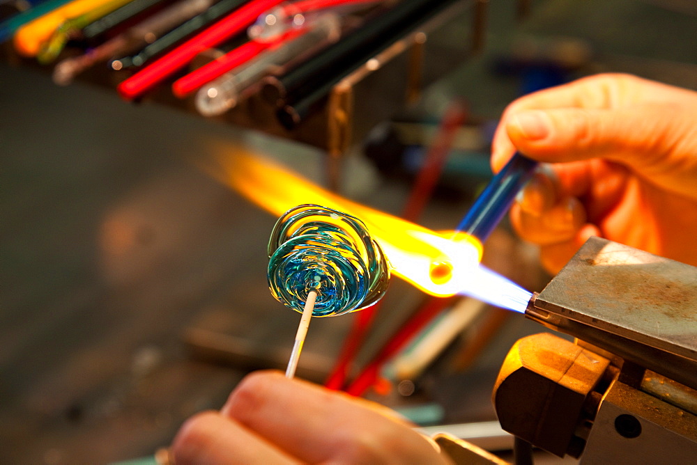 Student making a glass bead, Abate Zanetti glass school, Murano island, Venice, Veneto, Italy, Europe