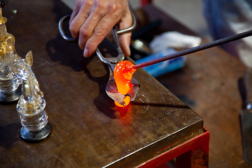 Master glassmaker making chessboard pawns, Murano island, Venice, Veneto, Italy, Europe