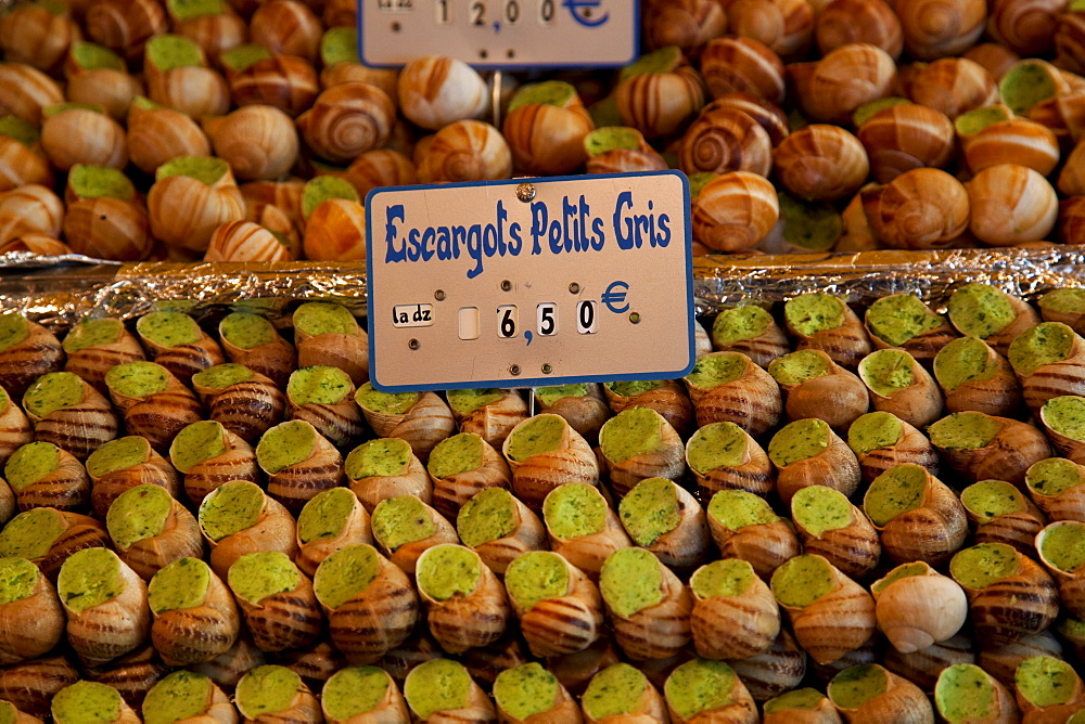 Escargot (edible land snails) for sale at local market in Paris, France, Europe