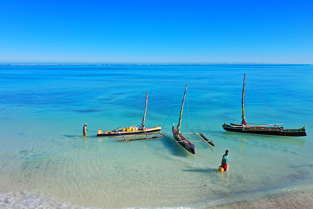 Outrigger boats on the coral reef near Salary, South Western coast of Madagascar, Indian Ocean, Africa