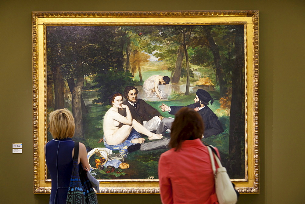 Visitors enjoying Le Dejeuner sur L'Herbe by Manet, Musee d'Orsay, Paris, France, Europe