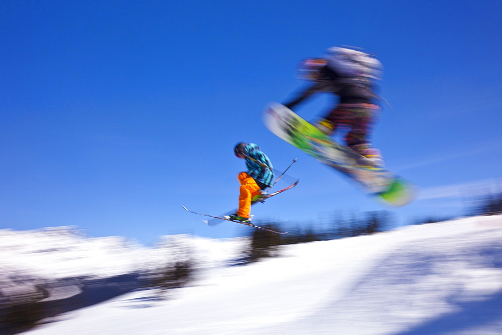 Snowboarder flying off a ramp, Whistler Mountain, Whistler Blackcomb Ski Resort, Whistler, British Columbia, Canada, North America