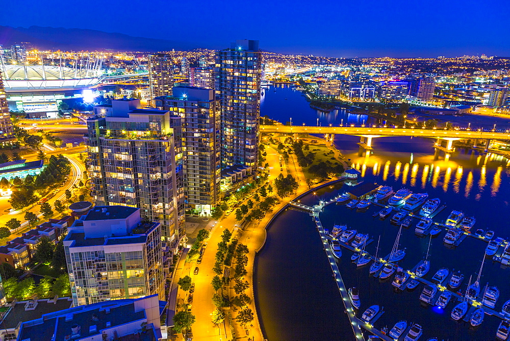 Aerial view, at twilight, showing Yaletown, downtown, False Creek, Cambie Street Bridge, Vancouver, British Columbia, Canada, North America