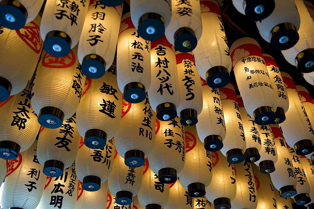 Lanterns with donors names hanging from the ceiling at Hozenji Temple in Namba, Osaka, Japan