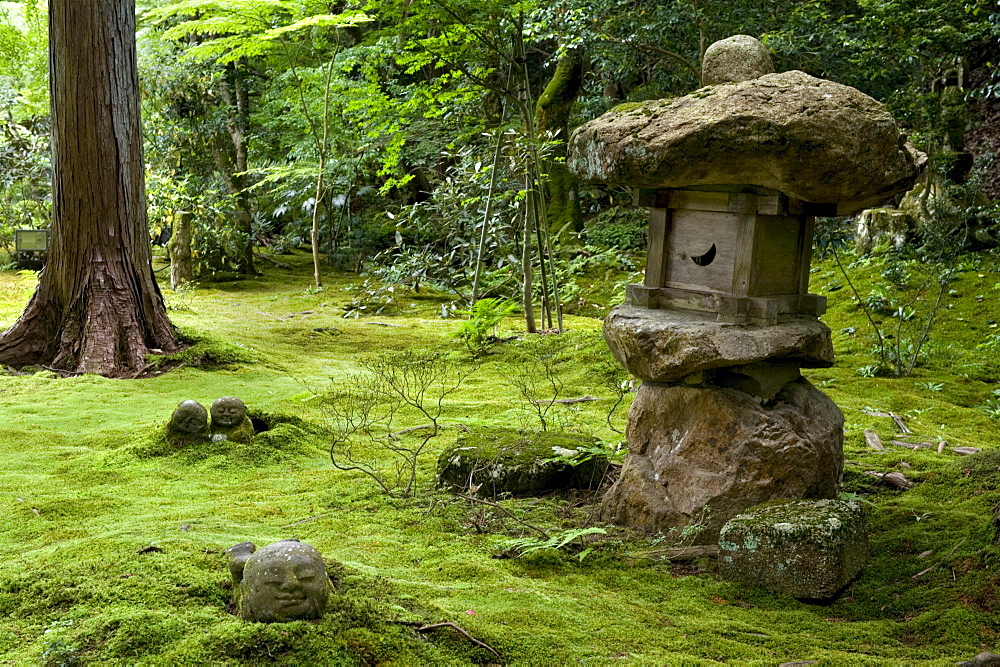 A rugged stone lantern accents a moss garden at Sanzenin Temple in Ohara, Kyoto, Japan, Asia