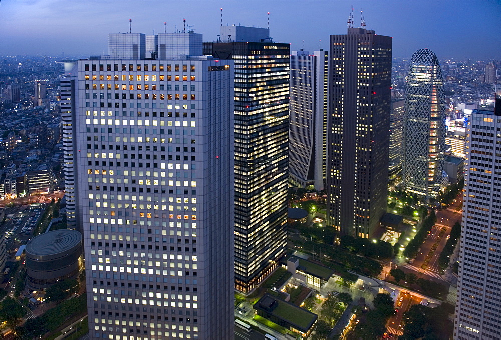 Evening skyline view of skyscraper high-rise corporate buildings in Nishi Shinjuku (West Shinjuku), Tokyo, Japan, Asia