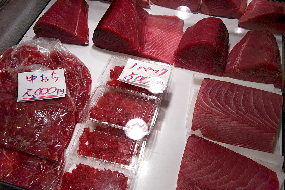 Raw maguro (tuna sashimi) for sale at Tsukiji Wholesale Fish Market, the world's largest fish market in Tokyo, Japan, Asia