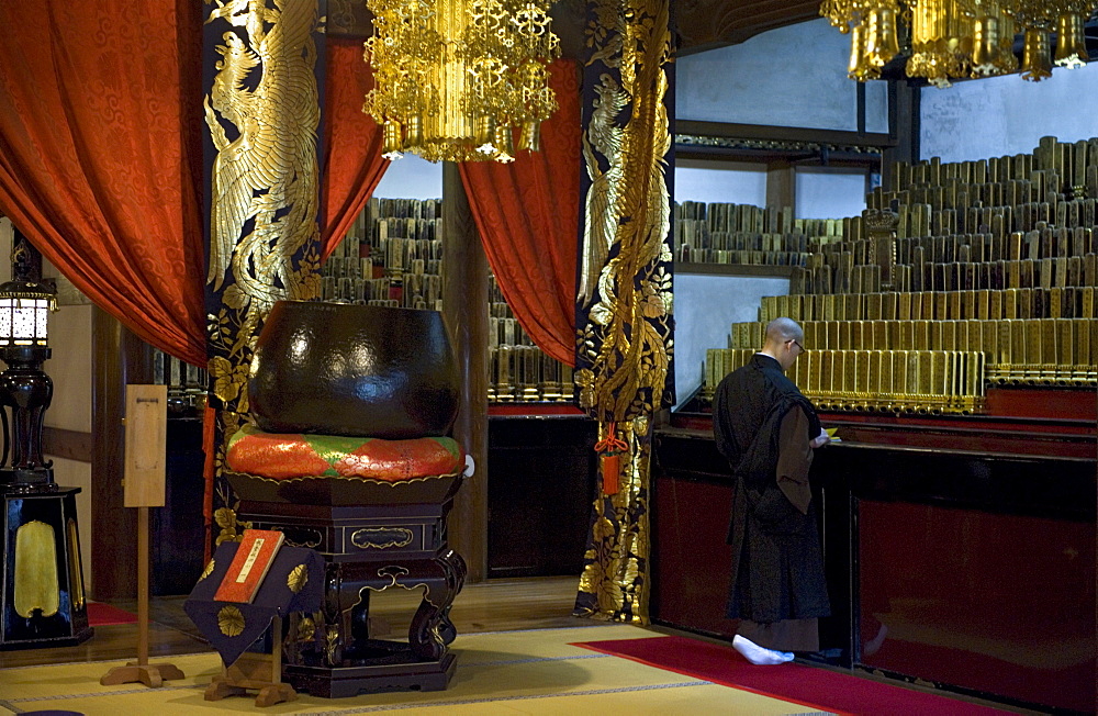 Monk inside Shidoden Memorial Hall at Eiheiji Temple, headquarters of the Soto sect of Zen Buddhism, Fukui, Japan