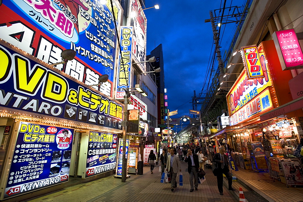 Adult shops line a busy street in the entertainment district of Okachimachi, Tokyo, Japan, Asia