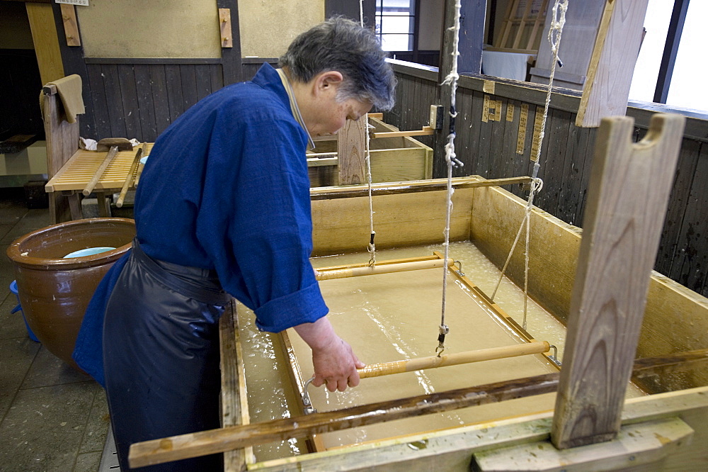 Making traditional Japanese washi paper at Echizen Washi No Sato village in Fukui, Japan, Asia