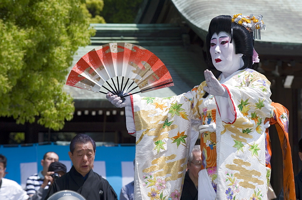 Man dressed as a woman performing classical Japanese dance called hobu at Meiji Jingu shrine, Tokyo, Japan, Asia