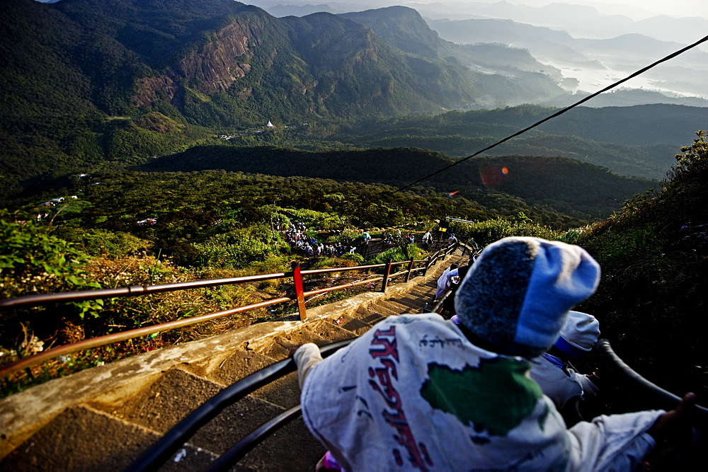 Pilgrims descending Sri Pada (Adam's Peak) in the morning sunlight, Sri Lanka, Asia 