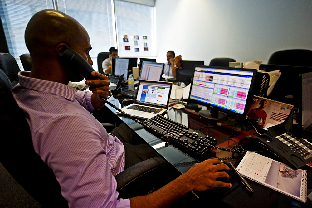 A trader at work on the 32nd floor of the World Trade Center in Colombo, Sri Lanka, Asia