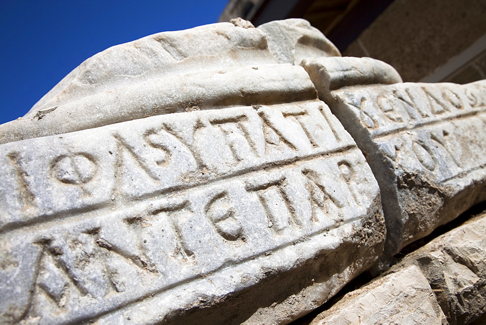 Greek inscription in a broken stone in Caesaria, Israel, Middle East