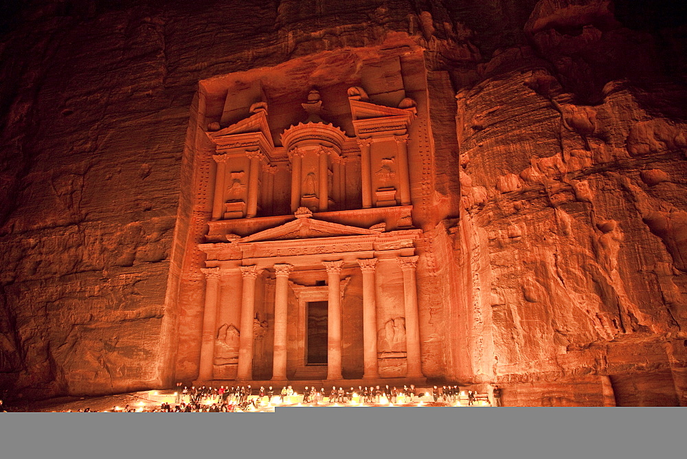 Nightime tourist show in candlelight, in front of the Treasury (El Khazneh), Petra, UNESCO World Heritage Site, Jordan, Middle East