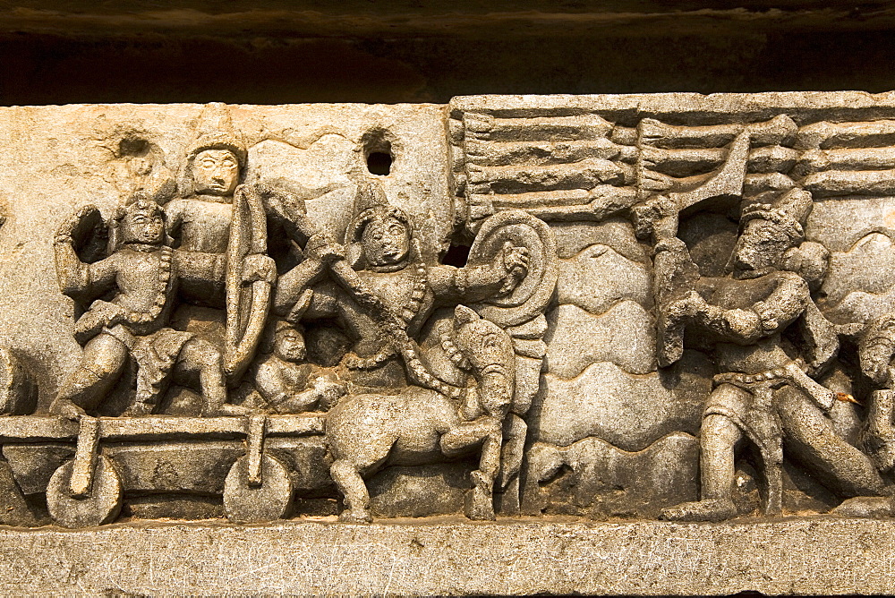 A bas relief detail showing Hoysala style warfare in the Hoysaleshvara Temple at Halebid, Karnataka, India, Asia