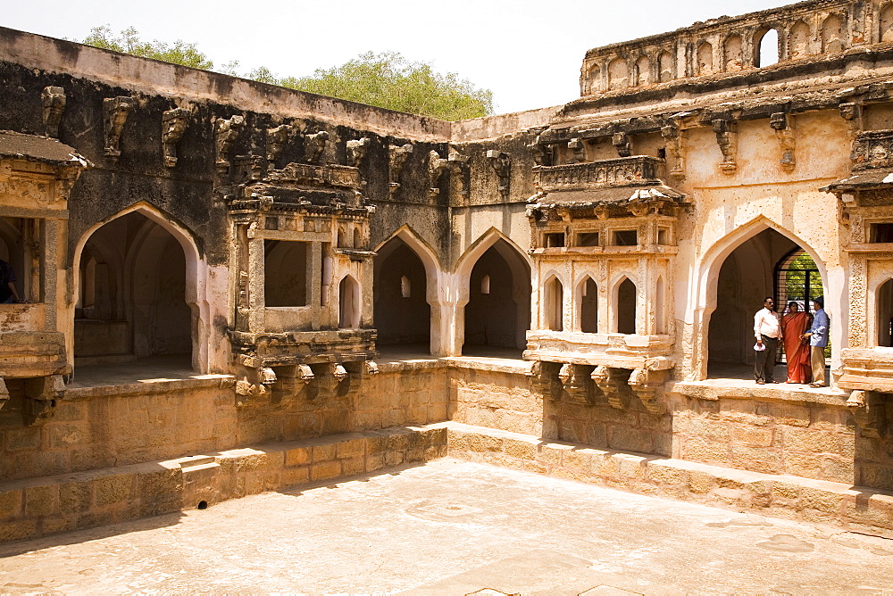 Indian tourists visit the Queen's Bath within the royal enclosure at Hampi, UNESCO World Heritage Site, Karnataka, India, Asia