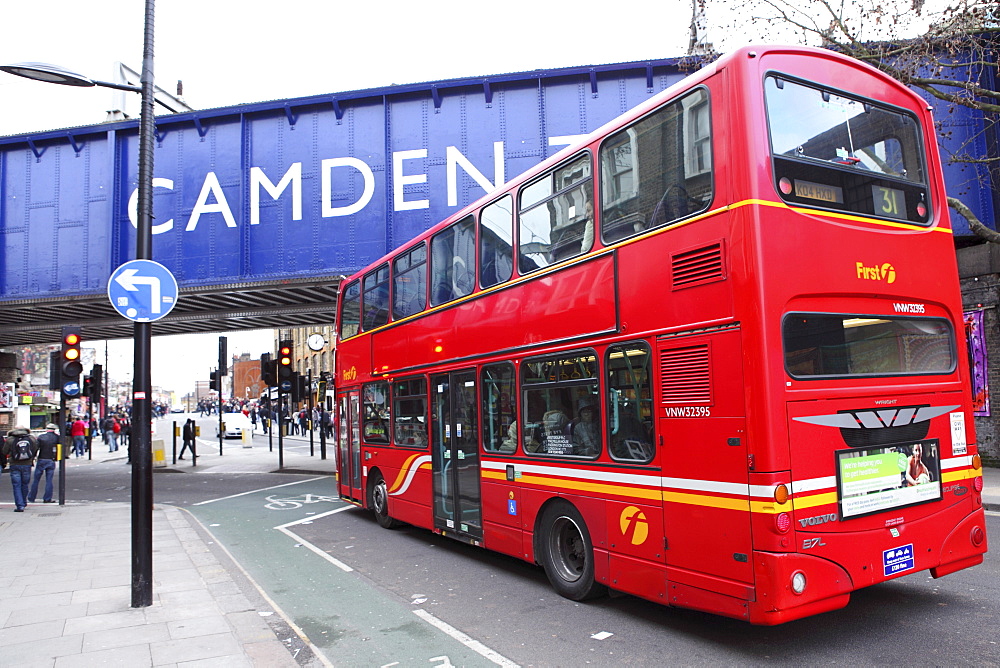 A red double decker bus drives towards the Camden Town area of London, England, United Kingdom, Europe