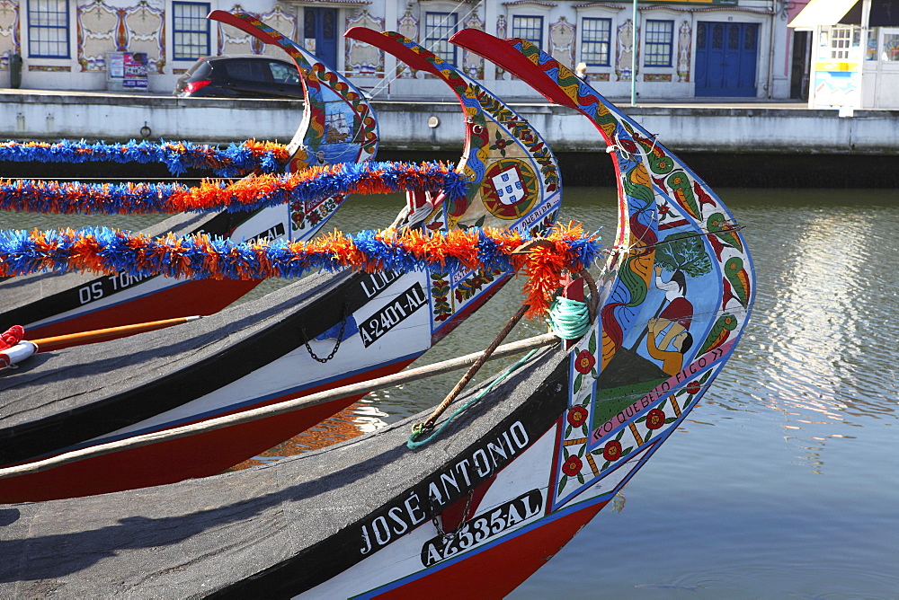 The prows of gondola-like Moliceiros, boats used to give tourists rides along the canals of Aveiro, Beira Litoral, Portugal, Europe