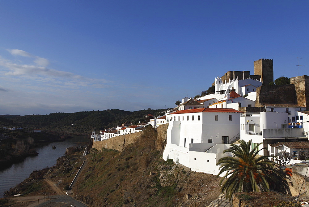 The 13th century castle and walled city, with a strong Islamic history, overlooking the Guadiana River, Mertola, Alentejo, Portugal, Europe