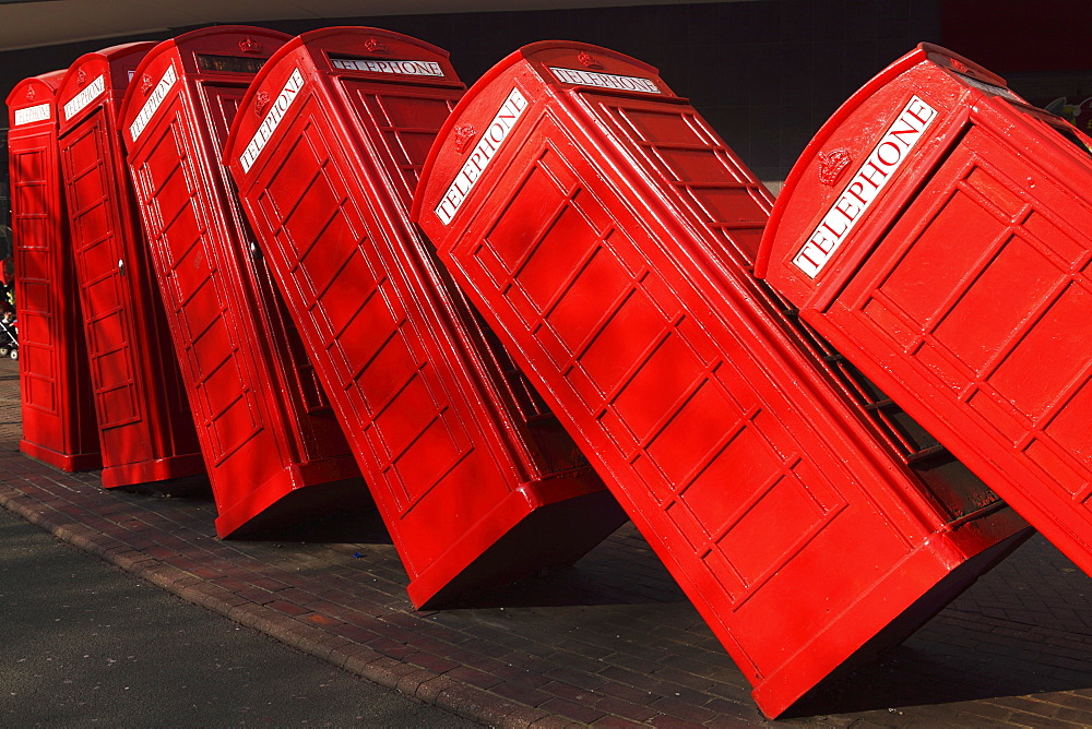 British red K2 telephone boxes, David Mach's Out of Order sculpture, at Kingston-upon-Thames, a suburb of London, England, United Kingdom, Europe