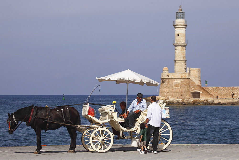 A horse and cart for city tours, at the Venetian era harbour, at the Mediterranean port of Chania (Canea), Crete, Greek Islands, Greece, Europe