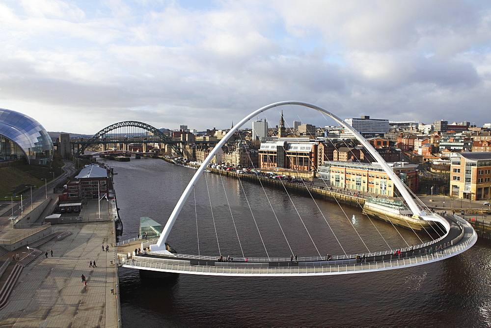 Millennium Bridge and Tyne Bridge span the River Tyne, from Gateshead to Newcastle, Tyne and Wear, England, United Kingdom, Europe