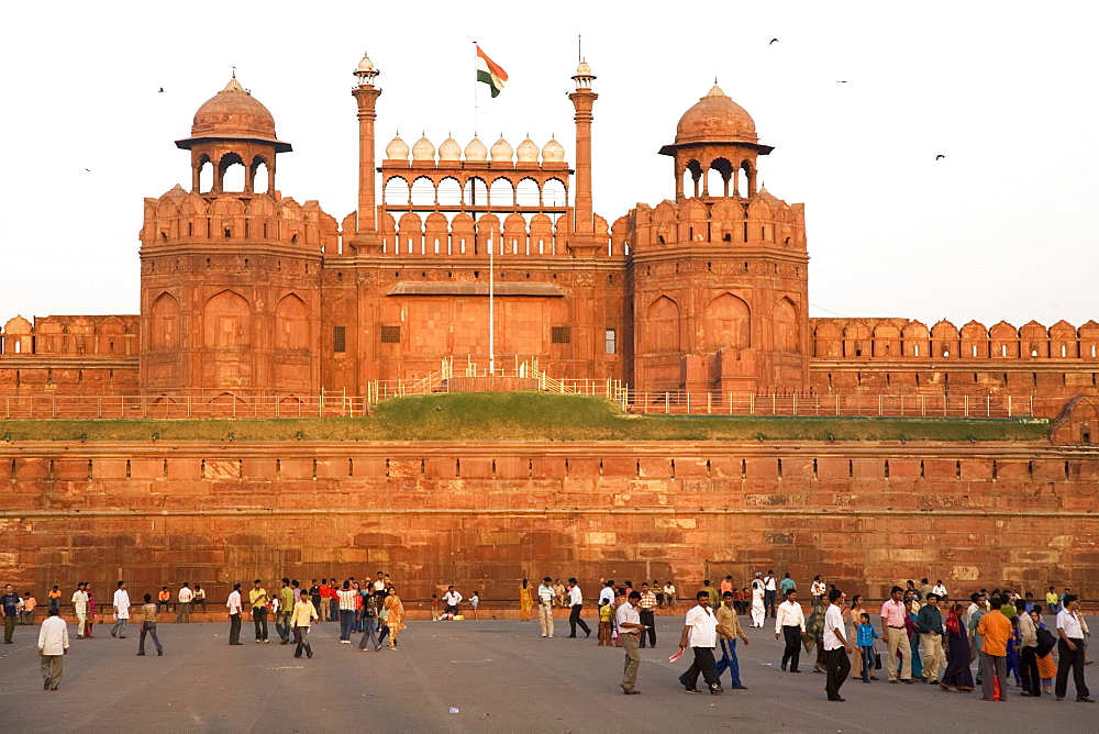 People enjoy an evening walk outside of the Red Fort (Lal Qila), built by Shah Jahan between 1638 and 1648, UNESCO World Heritage Site, Delhi, India, Asia