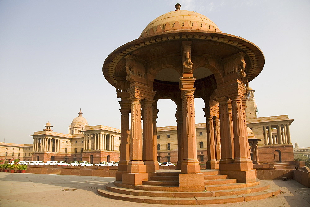 A chhattri stands in front of the Herbert Baker designed North Block Secretariat Building in New Delhi, India, Asia