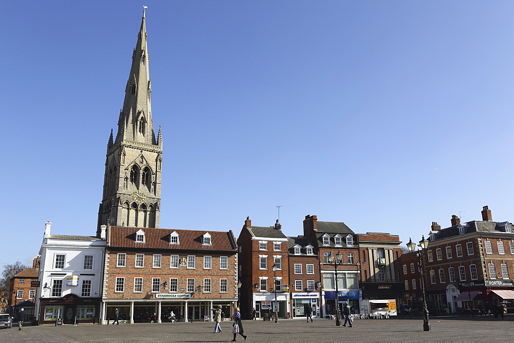 The spire of St. Mary Magdalene church rises over building on the Market Square in Newark-upon-Trent, Nottinghamshire, England, United Kingdom, Europe