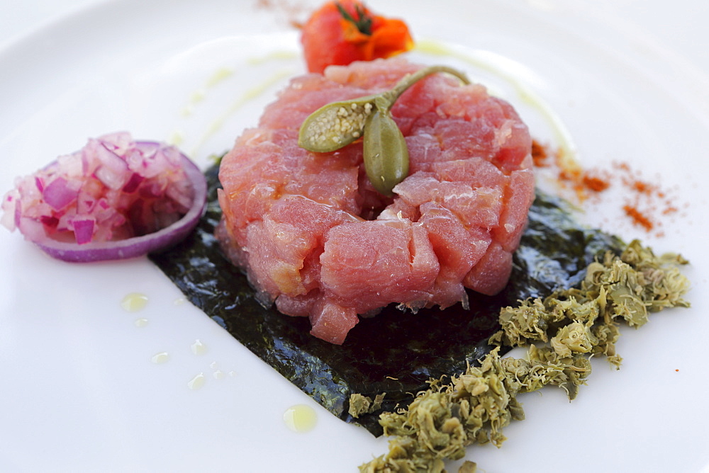 Red tuna tartare with oilive oil, a fig and onion served in Monopoli, Apulia, Italy, Europe