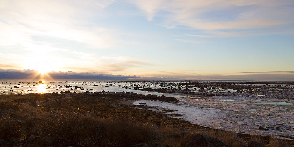 Sunrise over the semi-frozen Hudson Bay in northern Manitoba, Canada, North America