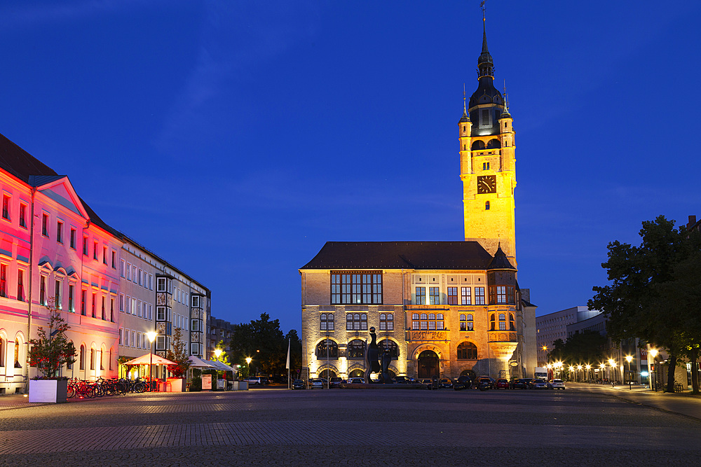 The illuminated city hall (Rathaus), with its Gothic-style clock tower, at night, in Dessau, Saxony-Anhalt, Germany, Europe