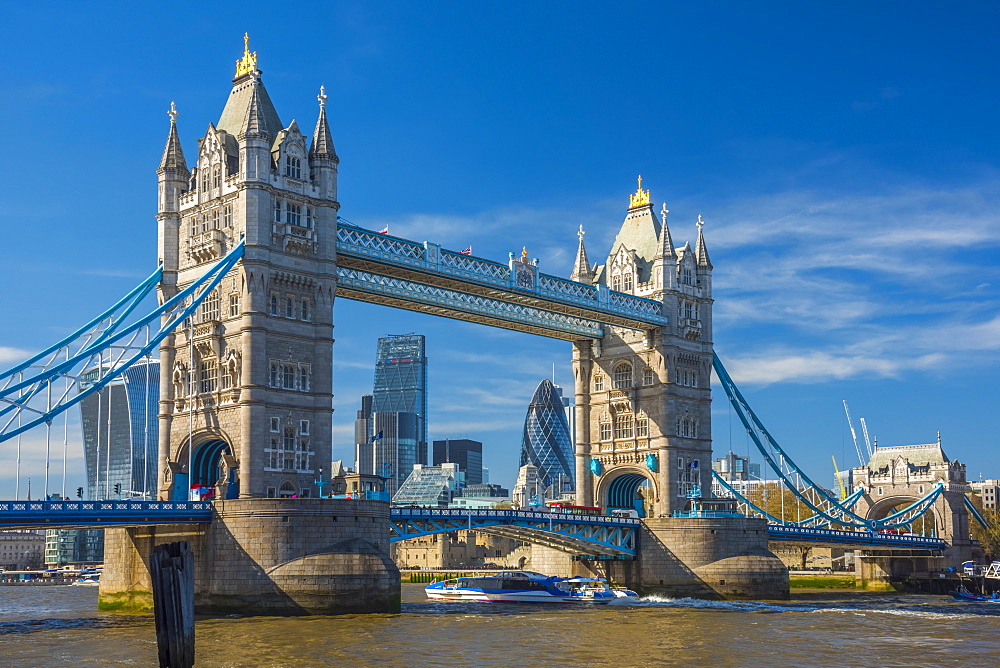 Tower Bridge over River Thames, City skyline including Cheesegrater and Gherkin skyscrapers beyond, London, England, United Kingdom, Europe