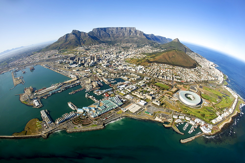 Aerial view of Cape Town showing Table Mountain, with Devil's Peak on the left, Lion's Head and Signal Hill on right, and the new Green Point stadium in the foreround, Cape Town, South Africa, Africa