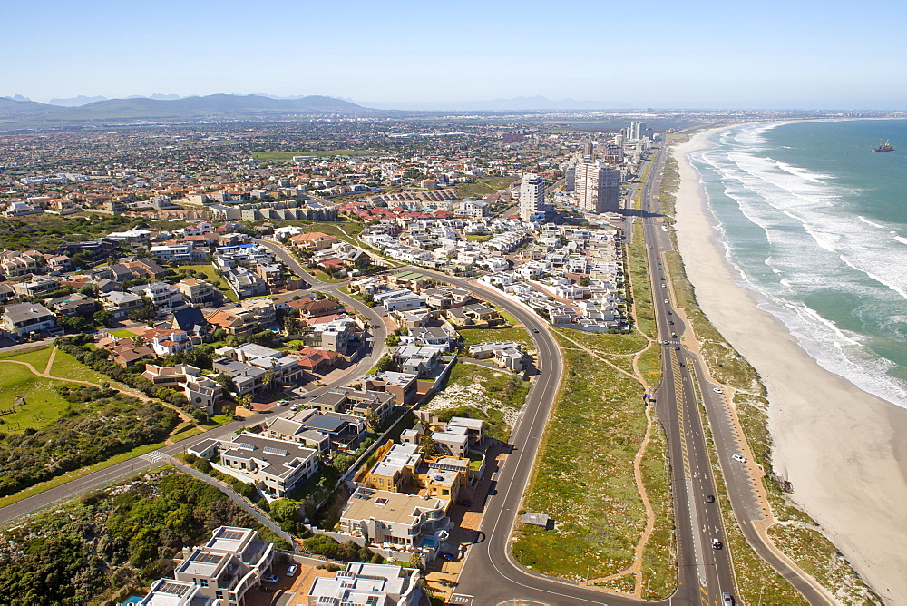 Aerial view down the beach and over the suburbs of West Beach, Blouberg and Table View in Cape Town, South Africa, Africa