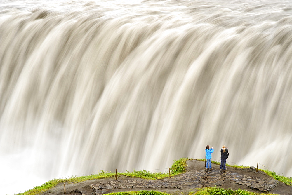 Tourists photographing Dettifoss waterfall near Myvatn in Vatnajokull National Park, northeast area, Iceland, Polar Regions