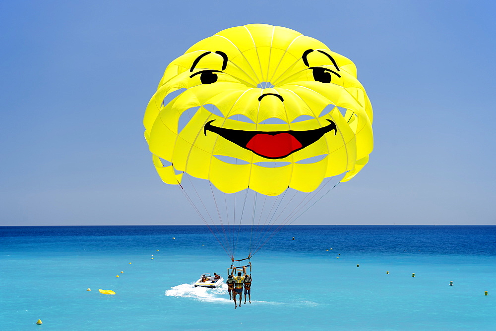 Smiley-faced parasail in the Baie des Anges (Bay of Angels), Nice, Provence, Cote d'Azur, French Riviera, France, Mediterranean, Europe