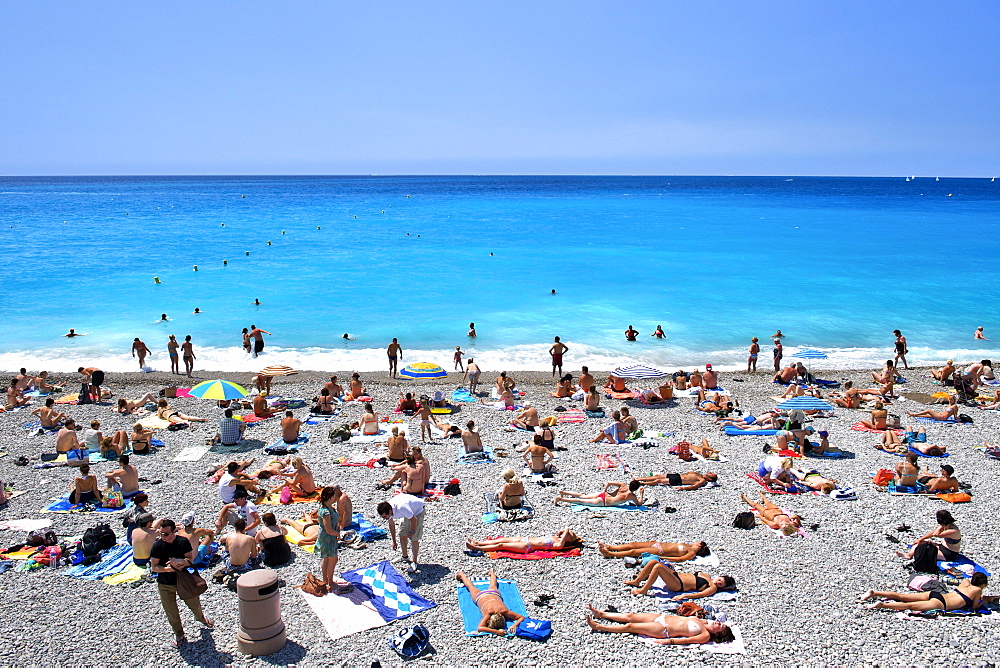 The beach and waters of the Baie des Anges (Bay of Angels), Nice, Provence, Cote d'Azur, French Riviera, France, Mediterranean, Europe