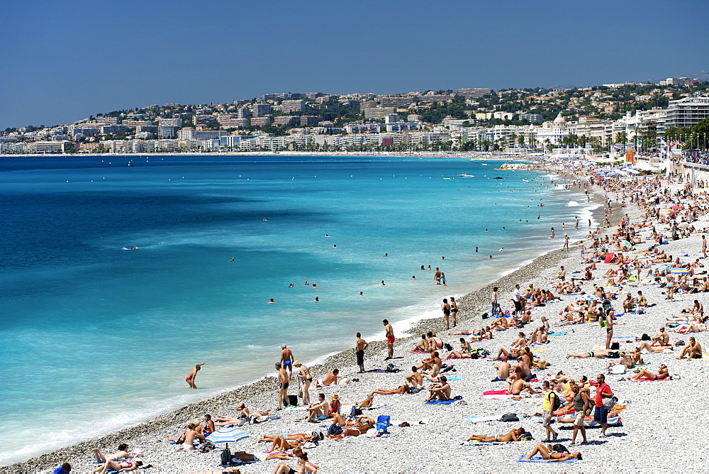 The beach and waters of the Baie des Anges (Bay of Angels), Nice, Provence, Cote d'Azur, French Riviera, France, Mediterranean, Europe