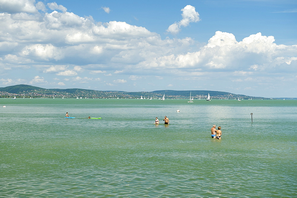 Holiday makers enjoying themselves in the waters of Lake Balaton, Tihany, Hungary, Europe