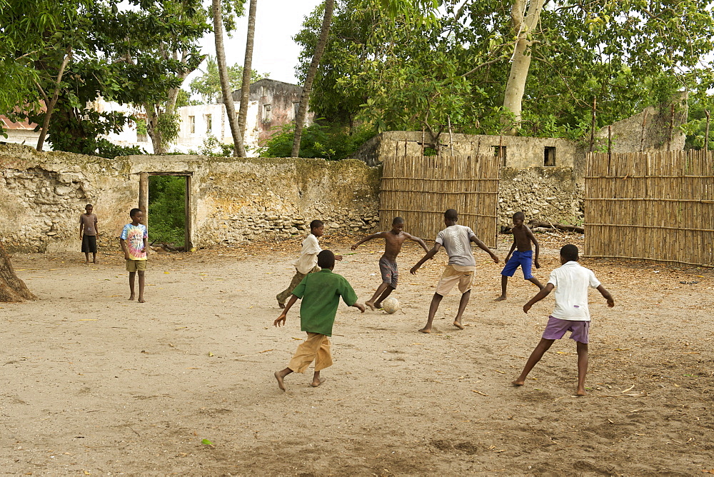 Kids playing soccer on Ibo island in the Quirimbas archipelago off the coast of northern Mozambique, Africa