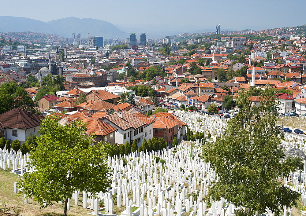 View across the Martyrs Memorial Cemetery in the foreground, to city, Sarajevo, Bosnia and Herzegovina, Europe