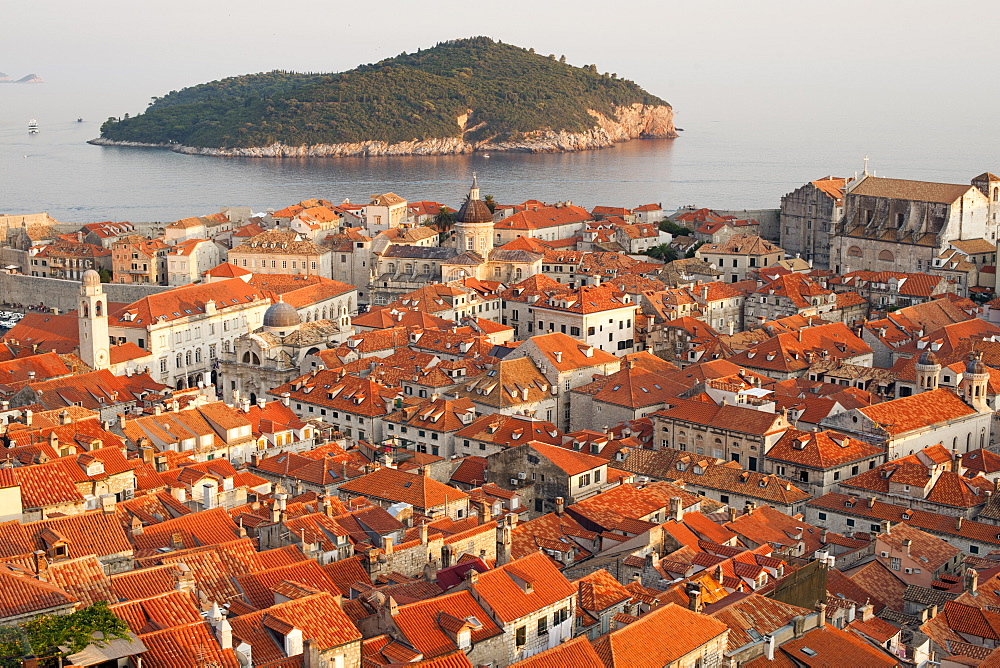 View over the rooftops of the old town in the city of Dubrovnik, UNESCO World Heritage Site, with Lokrum Island beyond, Adriatic Coast, Croatia, Europe